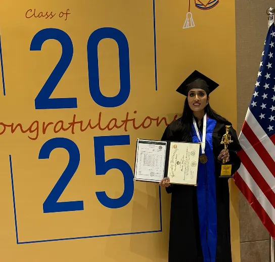 "Mamata Dhiraj Jain at her PhD graduation ceremony, Class of 2025, holding her degree in FDI and Property Market Evolution"