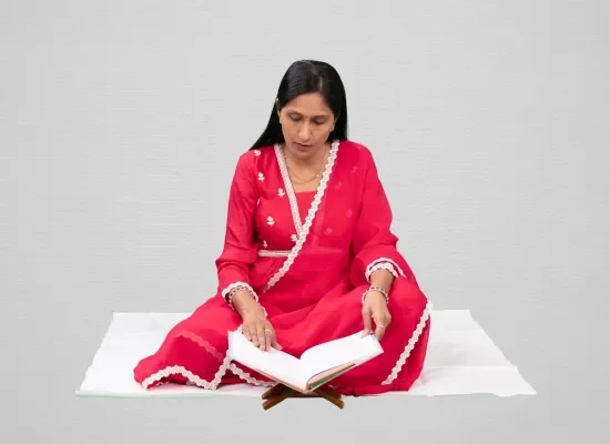 "Mamata Dhiraj Jain in a moment of spiritual reflection, reading"